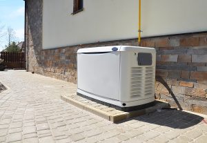Residential backup generator on a concrete pad. 