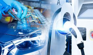 Close up of a an electrician with a gloved hand working on an EV charger.
