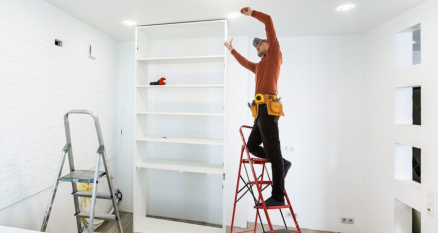 Electrician working on the lighting during a home renovation. 